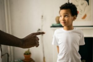 image of a child listening to his parent. Overall the image describes the idea "Can I Say 'No' To My Child"